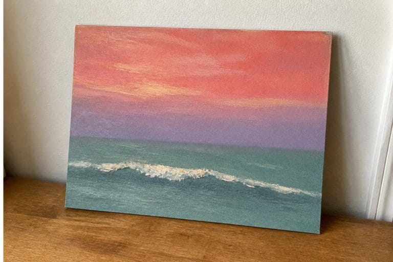 Canvas painting of pink-orange sunset sky over purple clouds and teal sea with white wave