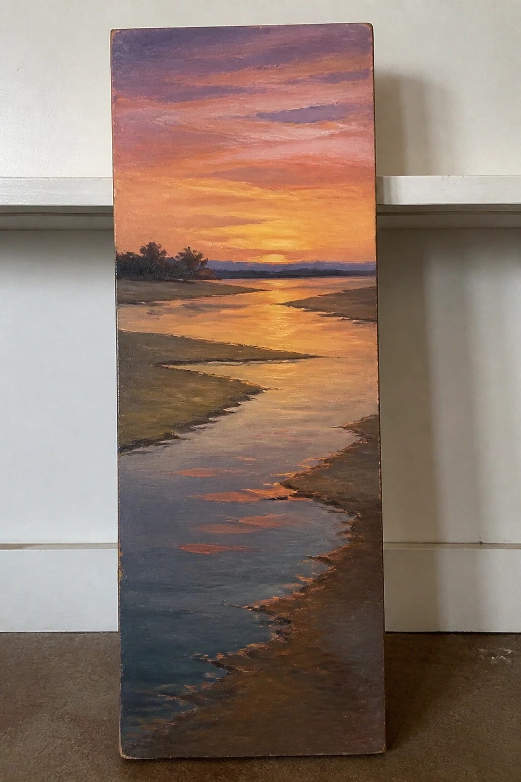 Vertical painting of vibrant orange-purple sunset reflecting on winding river.