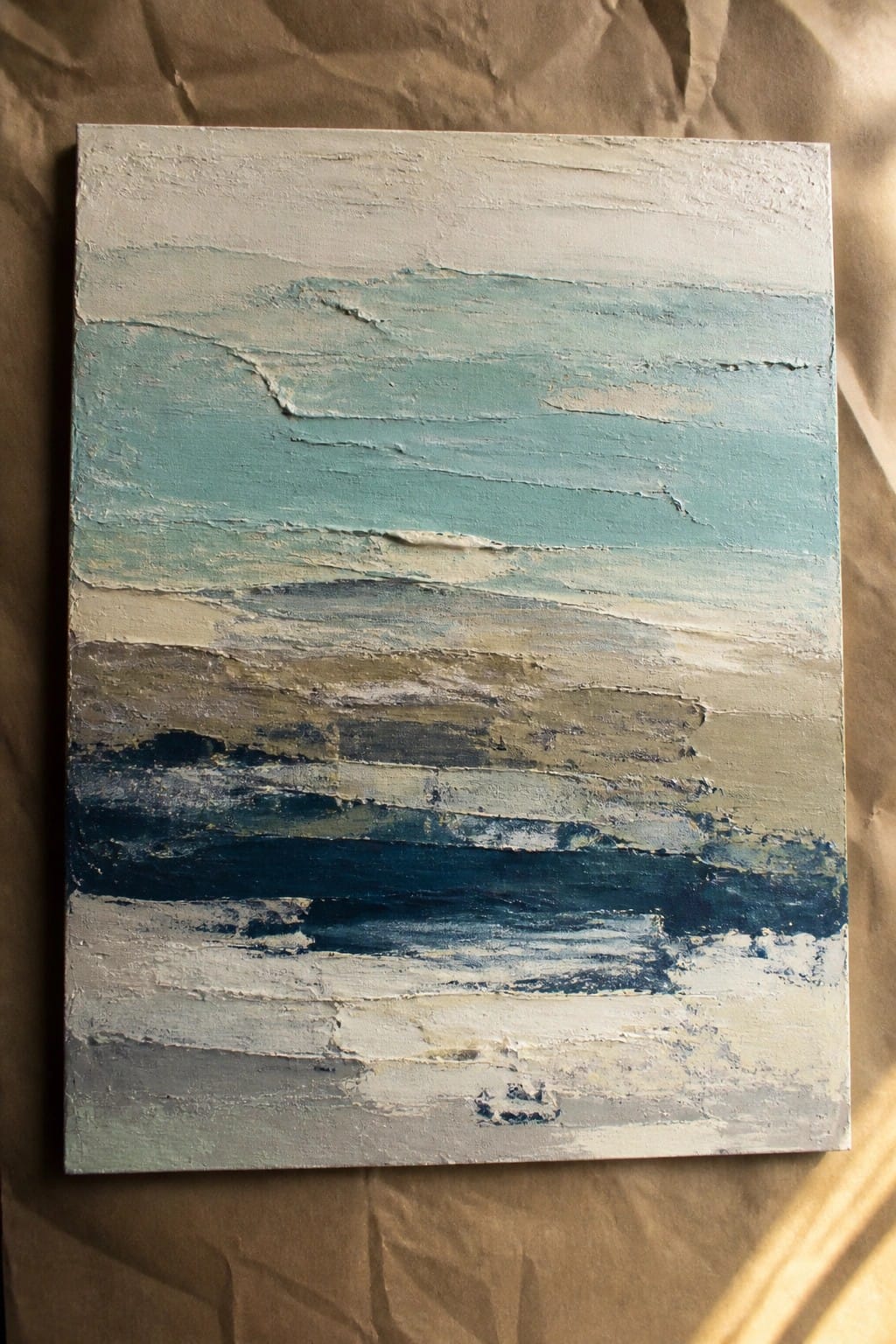 Abstract painting with textured horizontal layers of blue, teal, white, and gray.