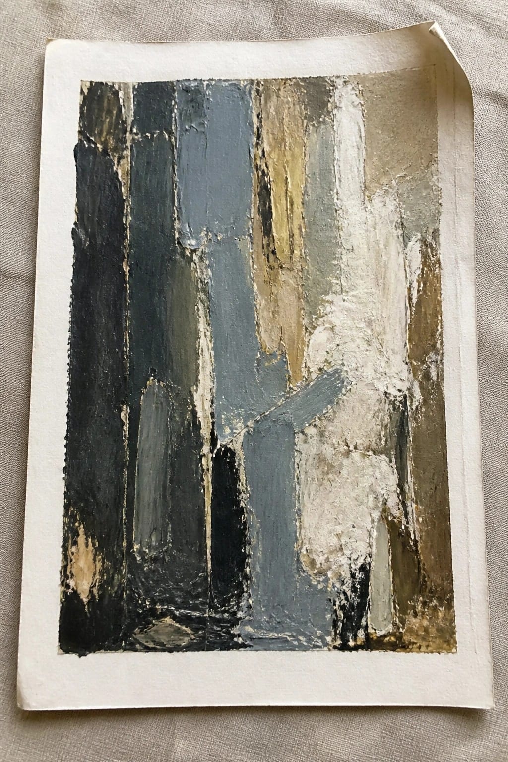 Abstract painting with thick vertical brushstrokes in dark blue, gray, white, and beige.