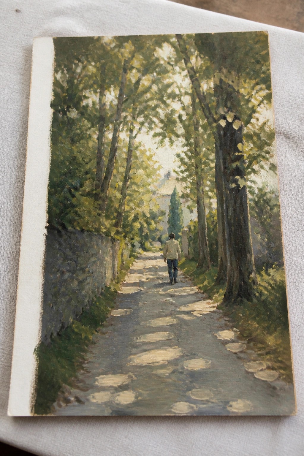 Impressionist painting of man in jacket walking on sunlit stone path amid trees