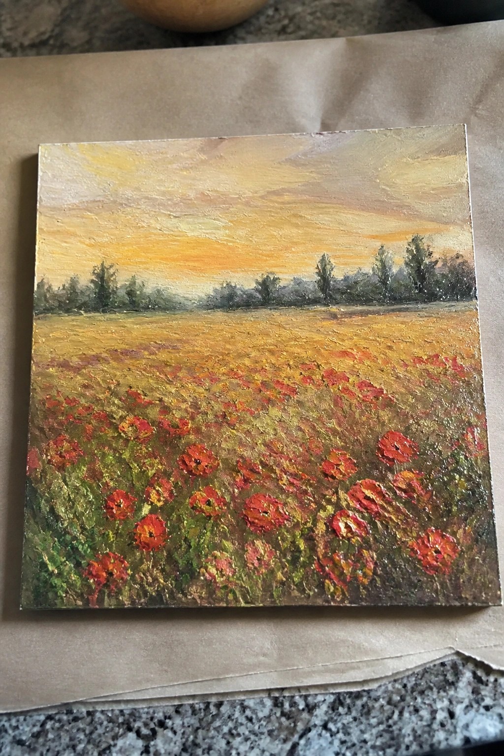 Impasto oil painting of red poppies blooming in a golden field at sunset.