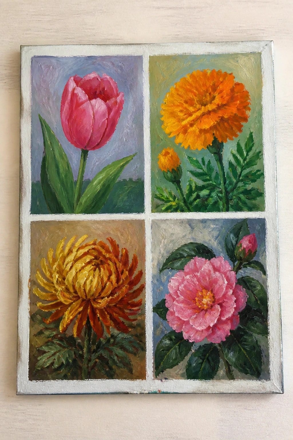 Four-panel painting of pink tulip, orange marigold, yellow chrysanthemum, and pink camellia.