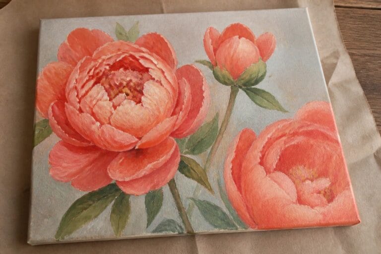 24 Beautiful Oil Painting Flowers Styled Around Realistic Botanical Details An oil painting of three coral peonies with green leaves on a light background, showing one open flower, one partial bloom, and one bud.