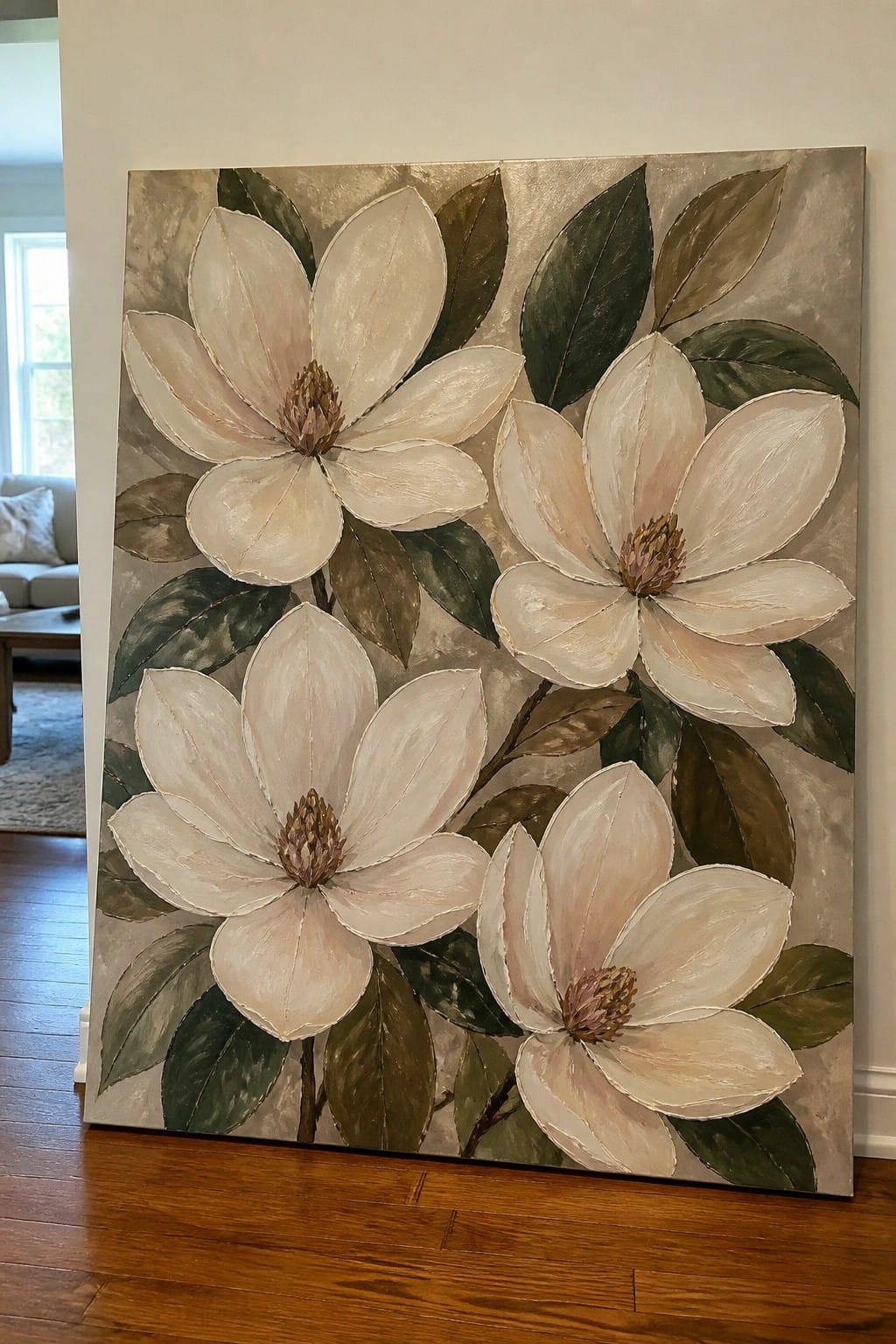 Large canvas painting of four white magnolias with green leaves on beige background