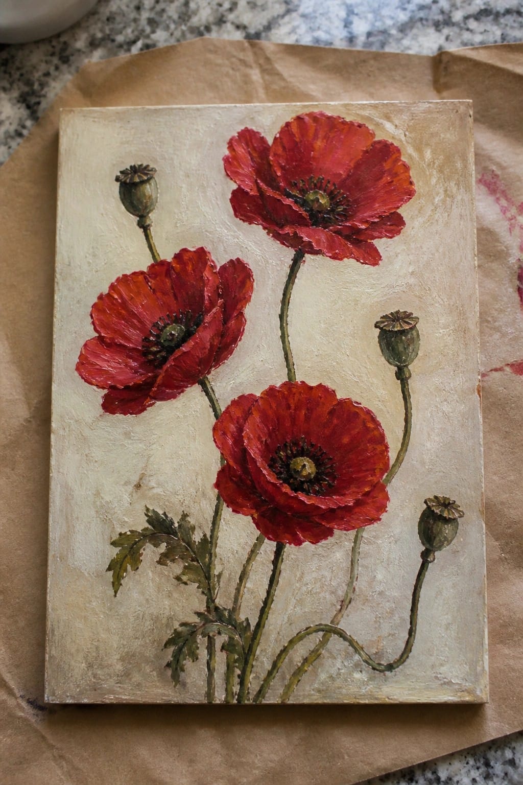 Vibrant red poppies with green stems and seed pods on textured beige canvas.