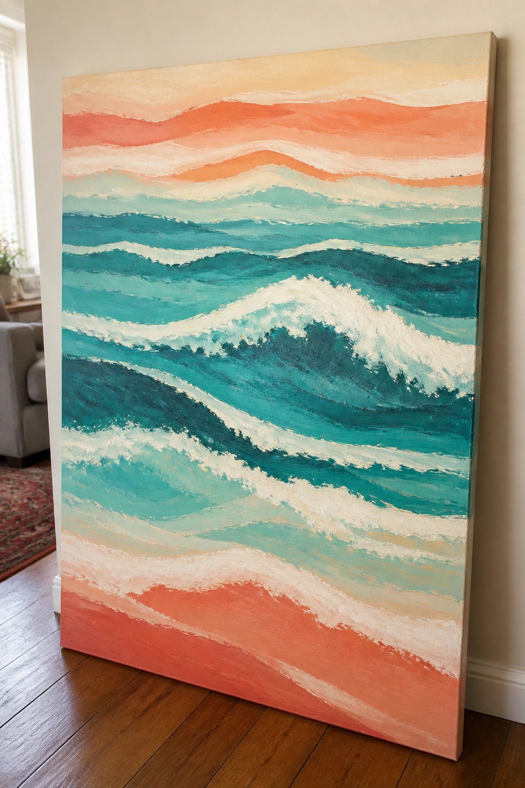 Colorful abstract painting of ocean waves in teal and coral leaning on wooden floor