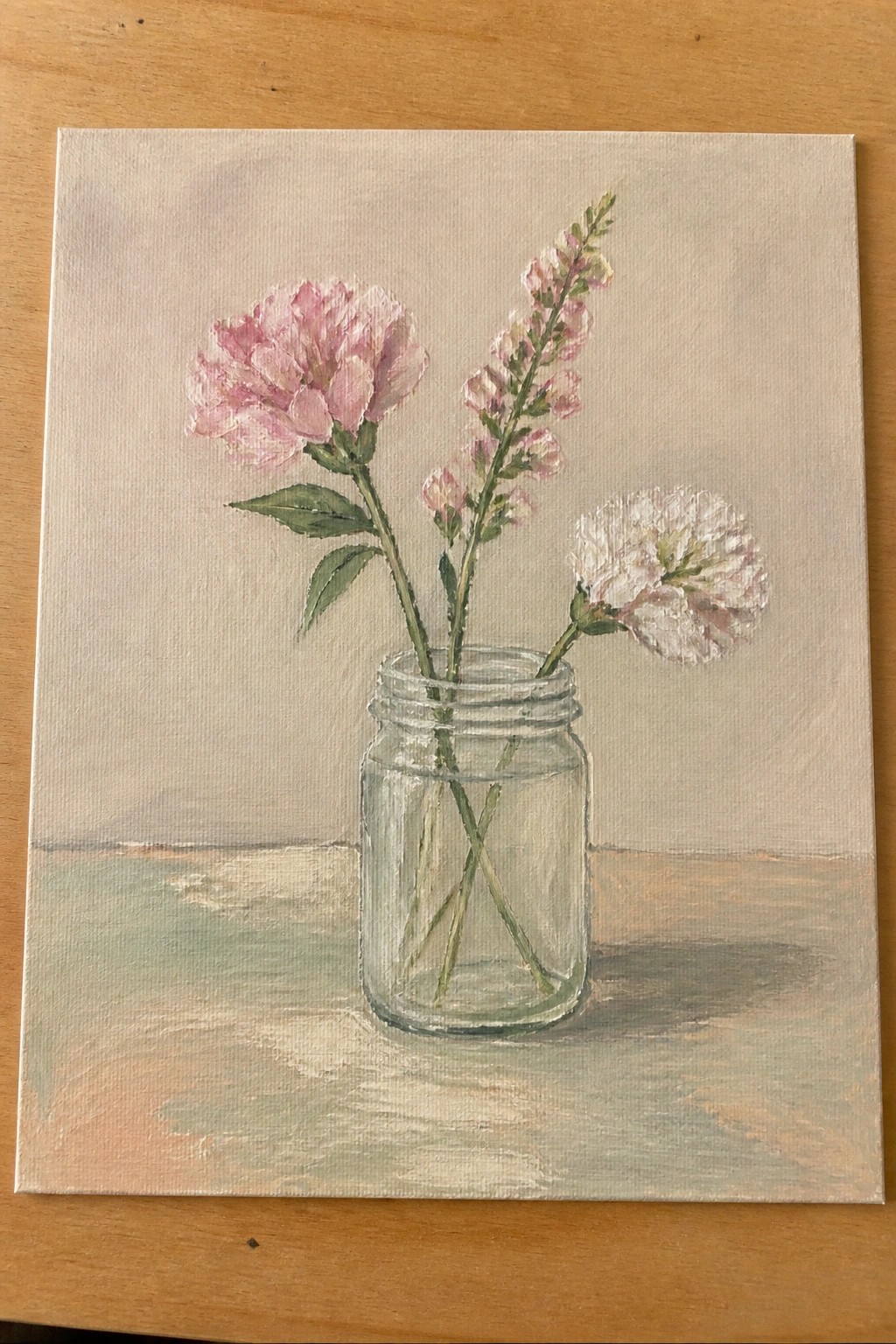Still life painting of pink peonies and white flowers in a glass mason jar.