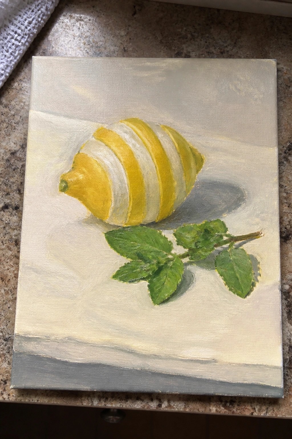 Striped yellow lemon with green leaves in still life painting on canvas