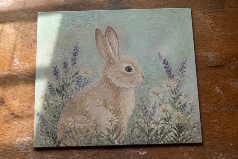 24 Charming Bunny Oil Painting Ideas in Soft Cottagecore Style Brown rabbit nestled among white daisies and purple lavender in soft green painting.