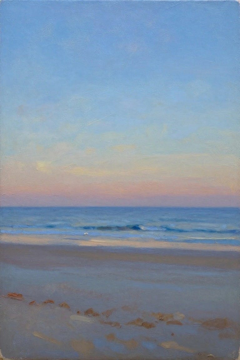 Tranquil ocean waves on sandy beach beneath soft pastel sky at dusk