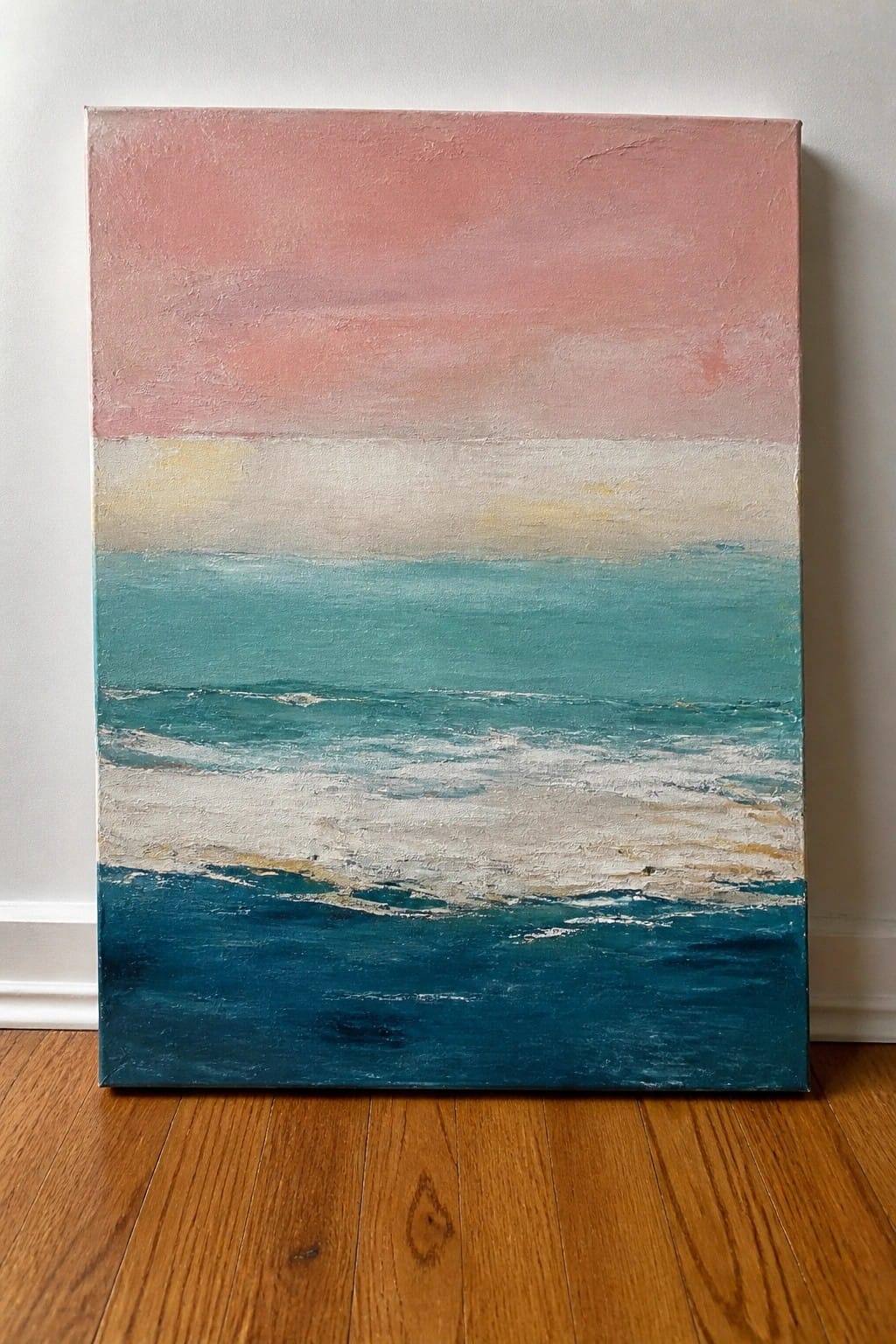 Abstract painting of ocean with pink sky, teal waves, and white foam on canvas.