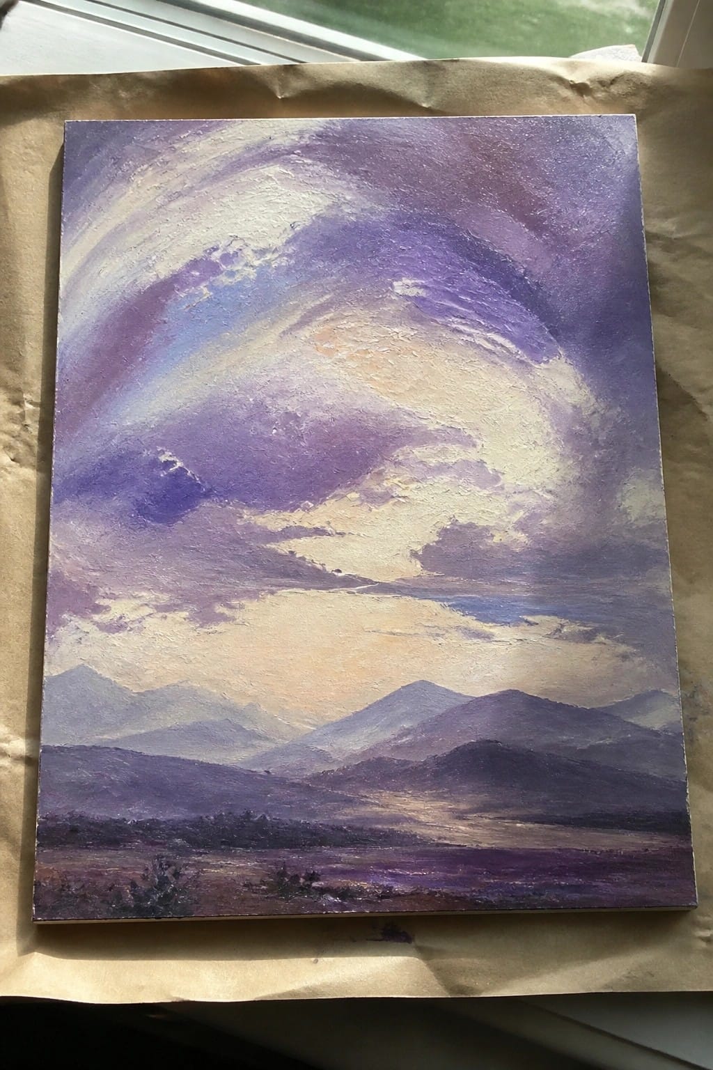 Thickly textured painting of purple mountains under dramatic lavender and white clouds.