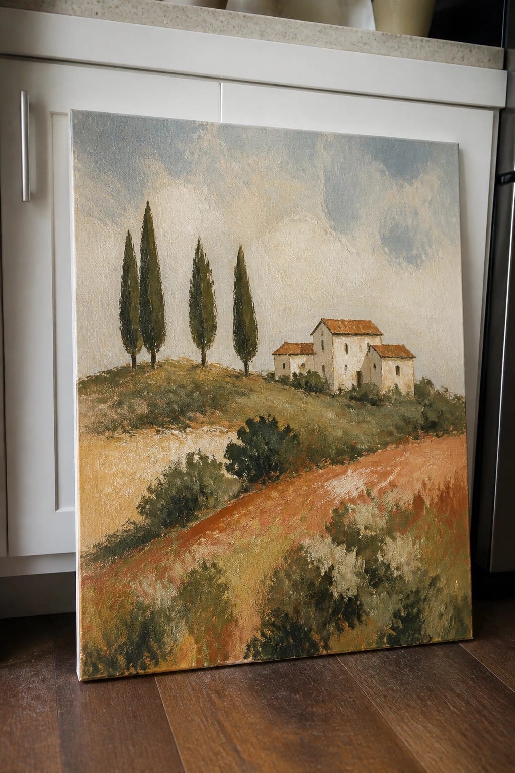 Impressionistic landscape painting of cypress trees and stone houses on a hill
