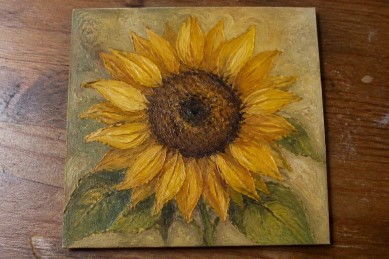 24 Fresh Flower Oil Painting Ideas Inspired by Sunflowers, Peonies, and Irises Sunflower painting with yellow petals, brown center, and green leaves on gold background