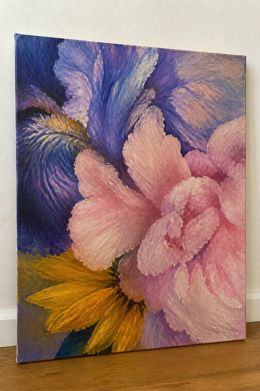 Vivid painting of pink peony bloom with purple iris and yellow flower petals