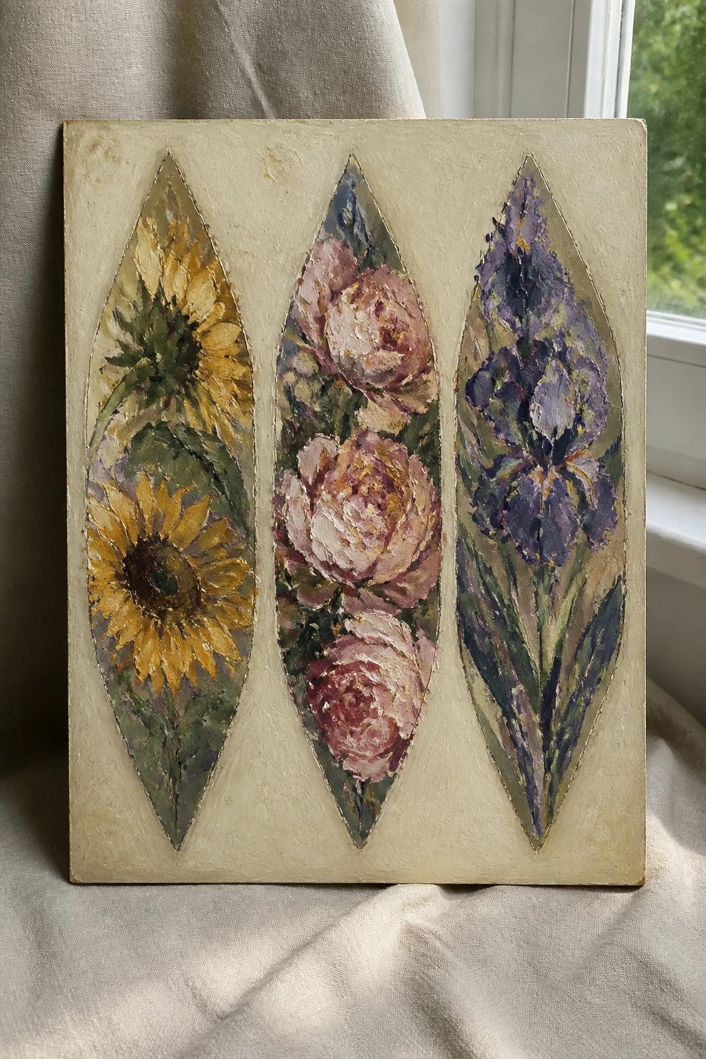 Three leaf-shaped panels with sunflowers, pink peonies, and purple irises on beige.