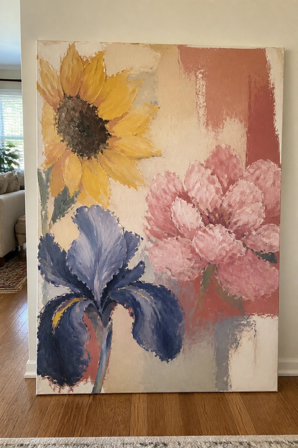 Abstract painting of yellow sunflower, pink peony, and blue iris with earthy tones