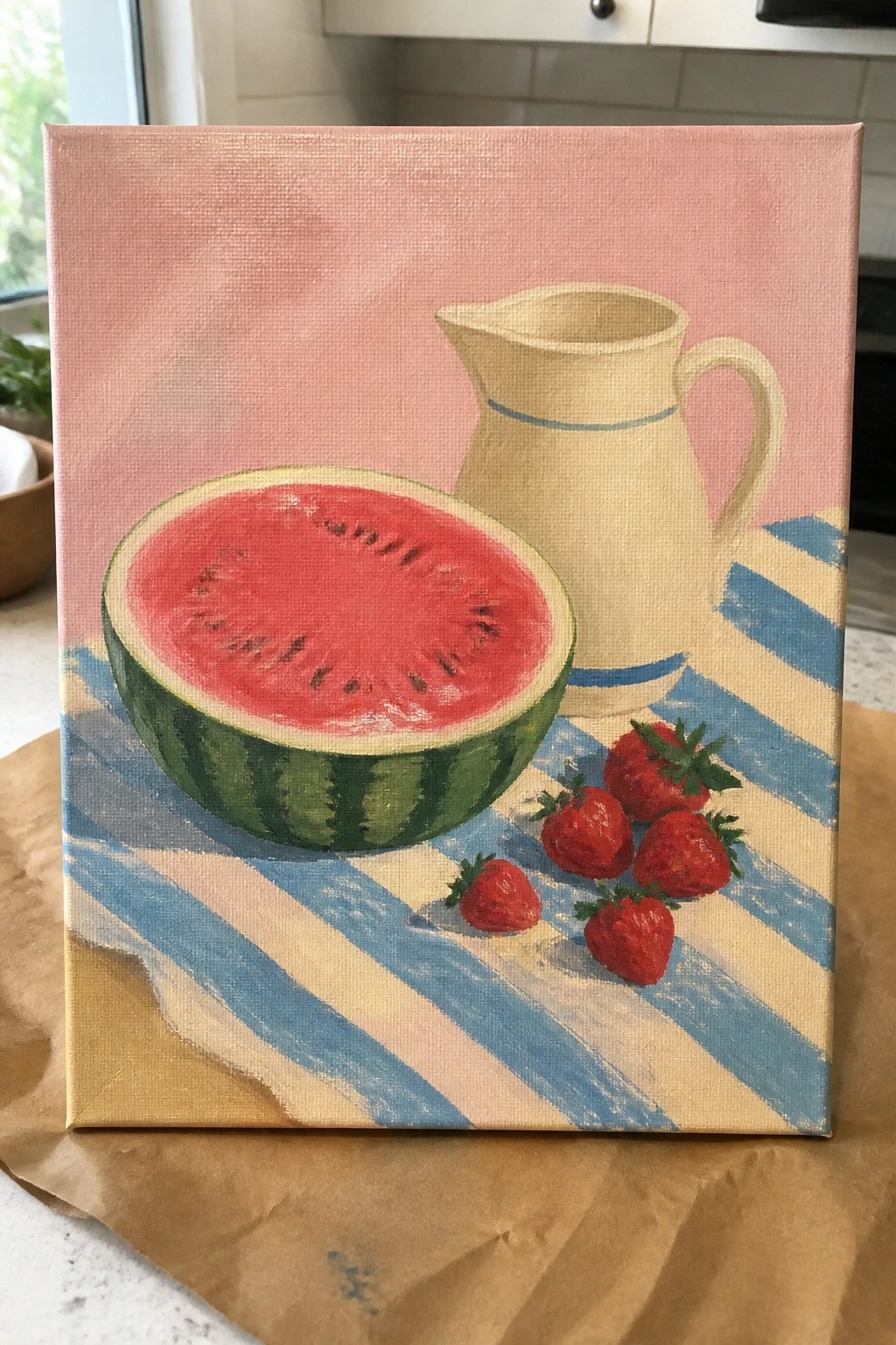 Still life painting of halved watermelon, cream pitcher, and strawberries on blue striped cloth.