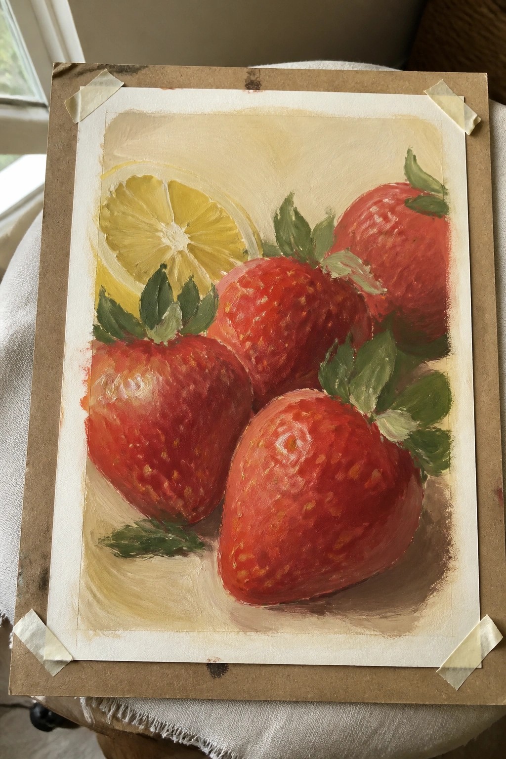Painting of red strawberries with green leaves and sliced lemon on beige background