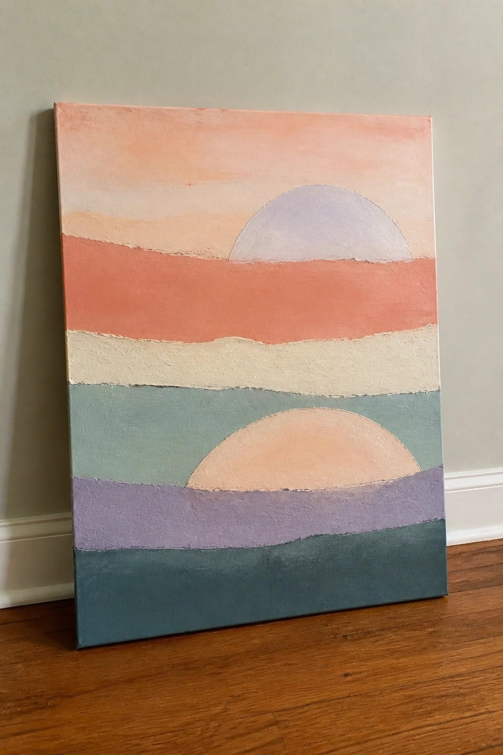Abstract canvas with soft pastel bands and two semicircles leaning on wooden floor