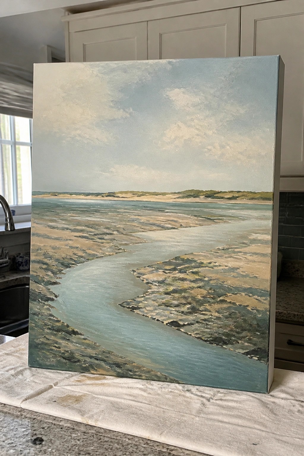 Impressionistic painting of winding blue river amid sandy tidal flats and dunes