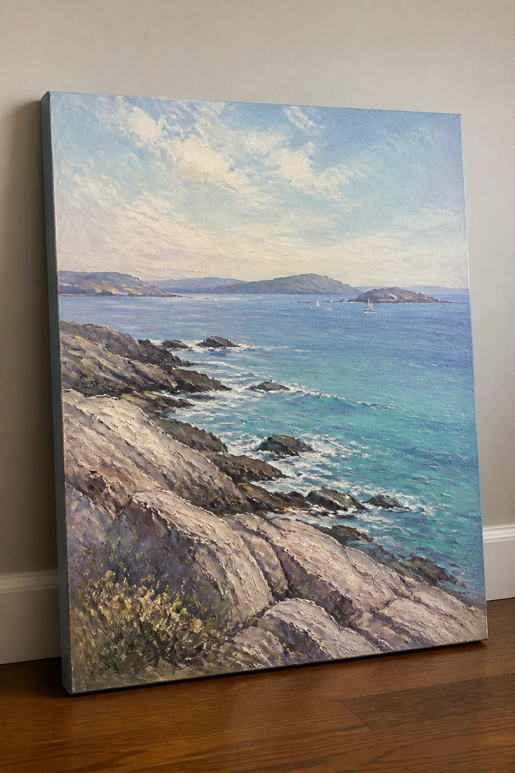 Rocky coastline painting with turquoise waves, sailboats, distant islands under cloudy sky.