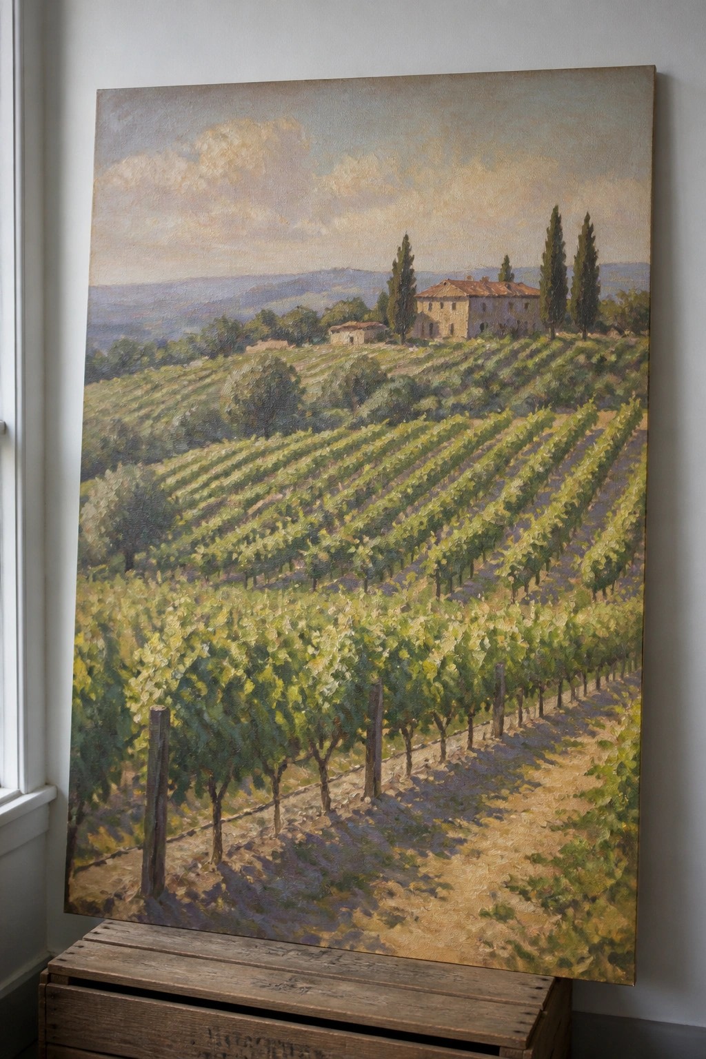 Oil painting of vineyard rows, stone villa, and cypress trees on wooden crate