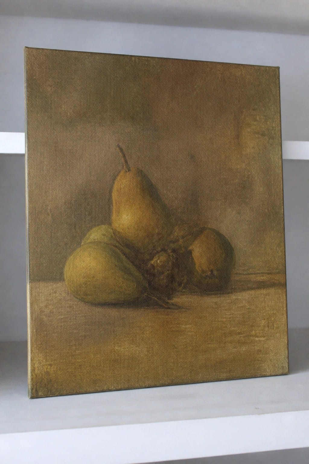 A realistic oil painting shows several pears clustered together on a surface, with some green and firm while others appear brown and soft, set against a dark textured background.