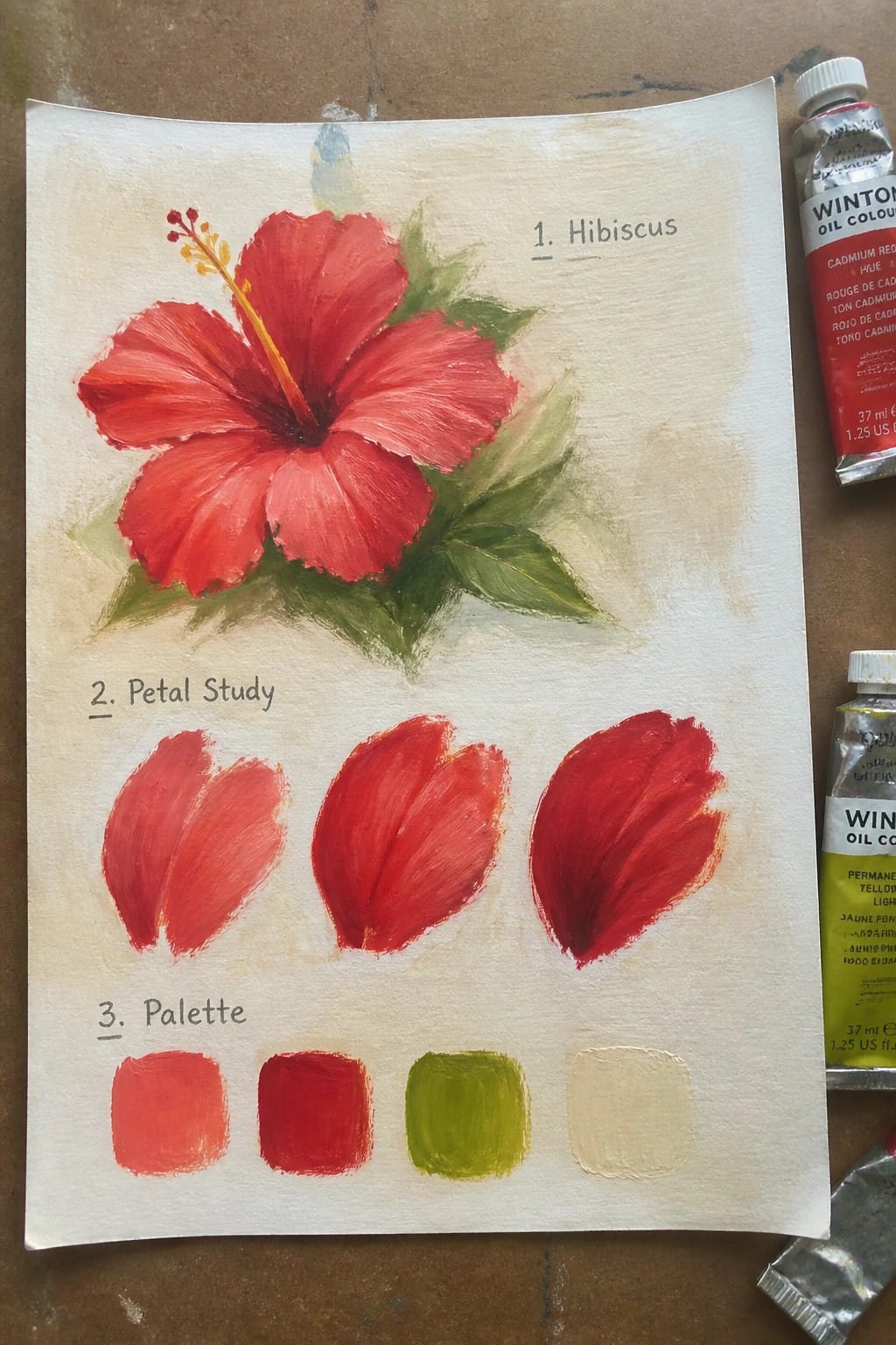 Red hibiscus oil painting with petal studies, color palette, and paint tubes