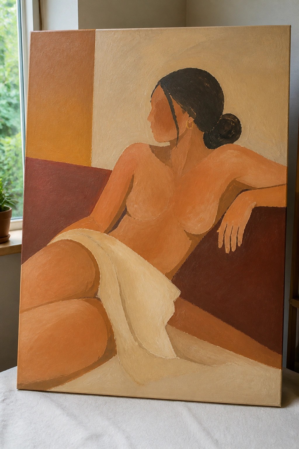 Oil painting of a nude woman with dark hair in a bun, seated and partially draped, against a background of large geometric blocks in warm brown and beige tones.