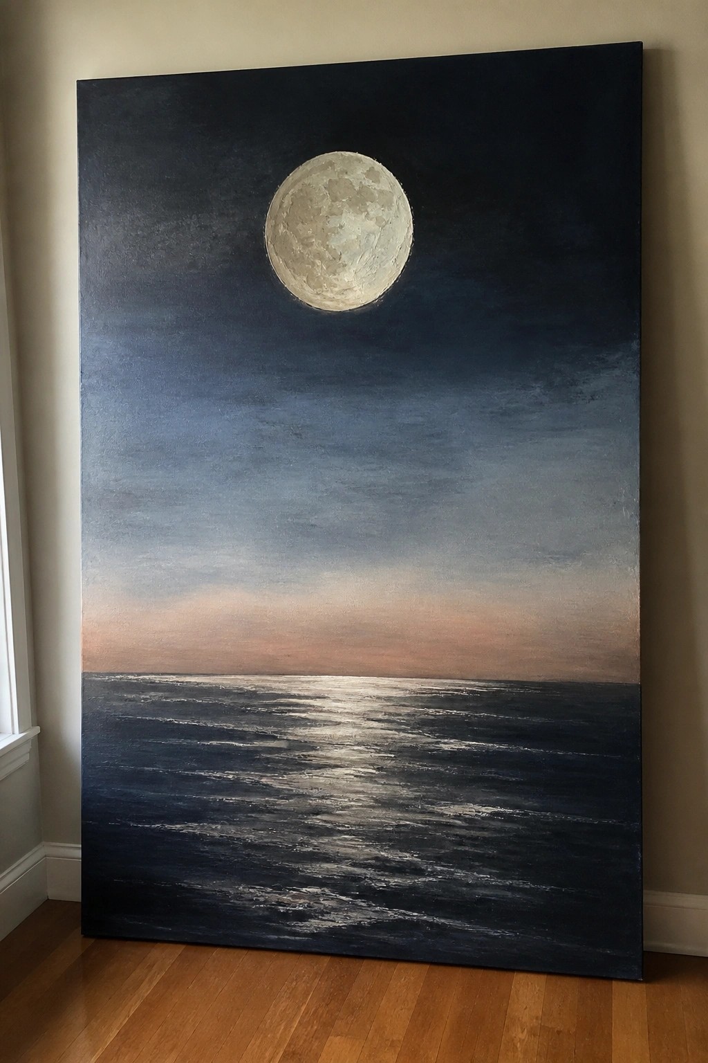 Large painting of full moon glowing over dark rippling ocean at dusk.