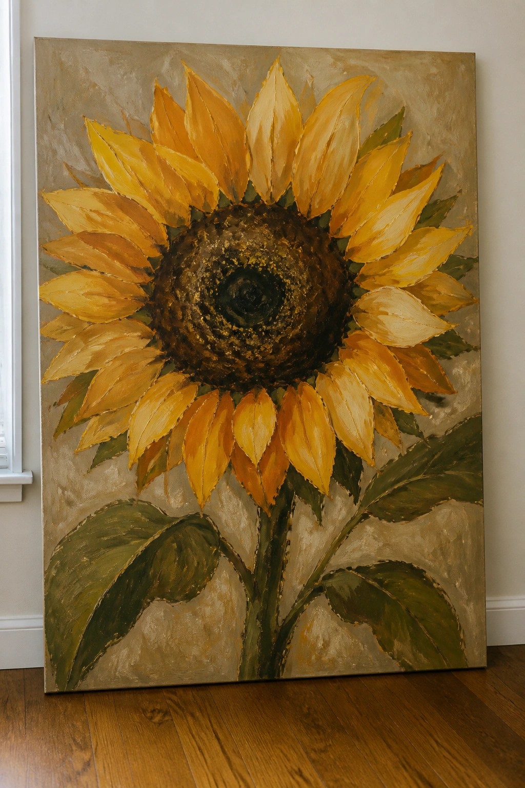 Large sunflower painting with yellow petals leaning against wall on wooden floor