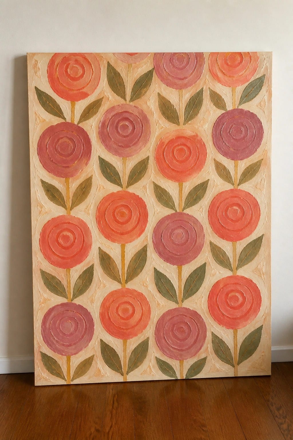 Colorful abstract painting of spiral roses in pink and orange with green leaves