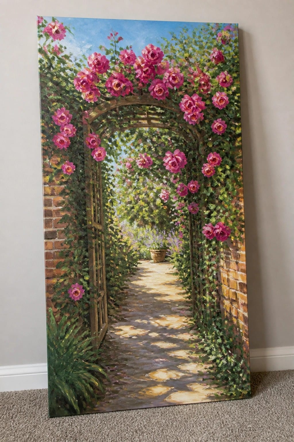 Oil painting of pink roses arching over a sunlit stone garden path between brick walls.