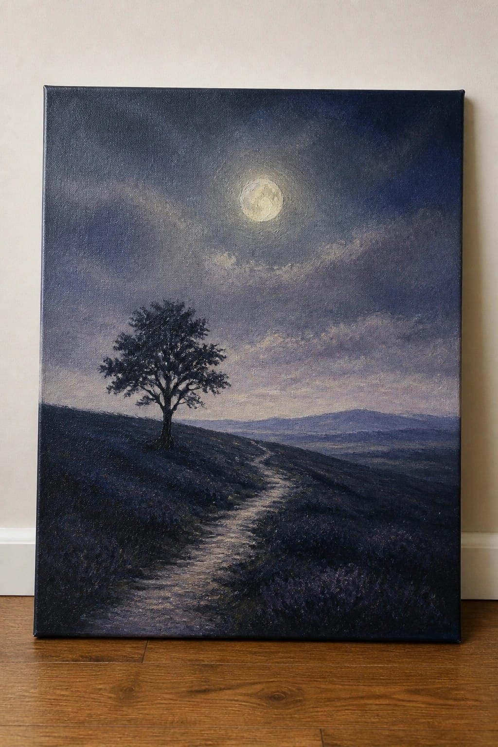 Moonlit landscape painting with lone tree, winding path, and cloudy night sky