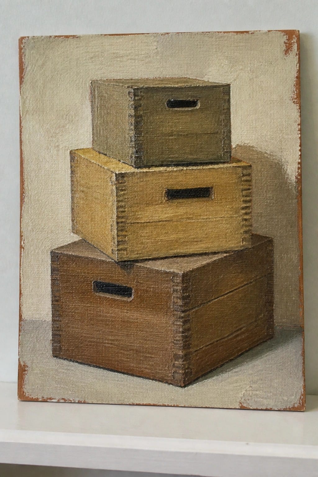 A realistic oil painting of three stacked wooden crates in brown and beige tones against a neutral background.