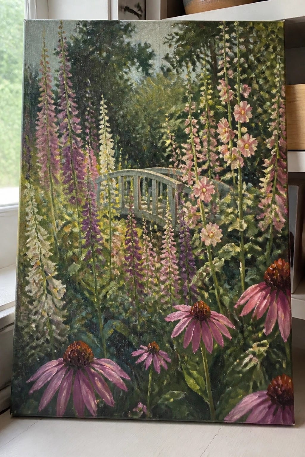 Lush garden painting with tall pink foxgloves, coneflowers, and arched wooden bridge amid greenery.