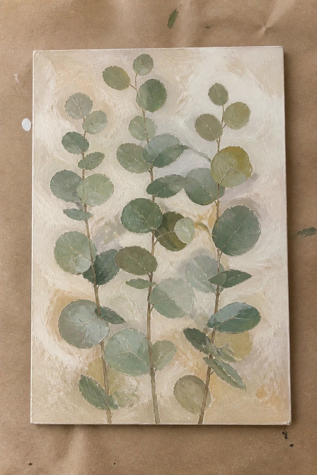 Painting of green round leaves on thin stems against a textured beige background