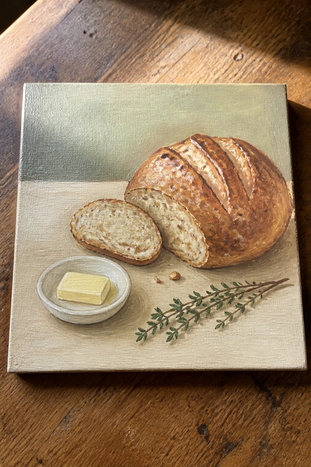 Realistic painting of sliced crusty bread loaf with butter dish and thyme sprig.