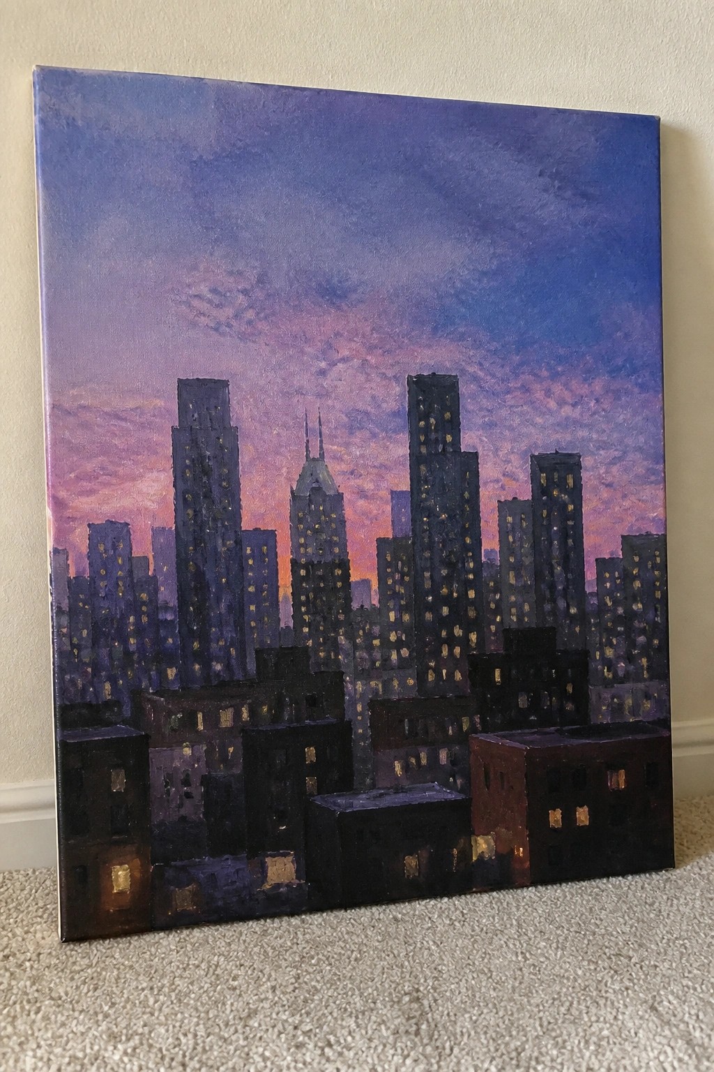 Cityscape painting of skyscrapers with glowing windows under a purple-pink sunset sky