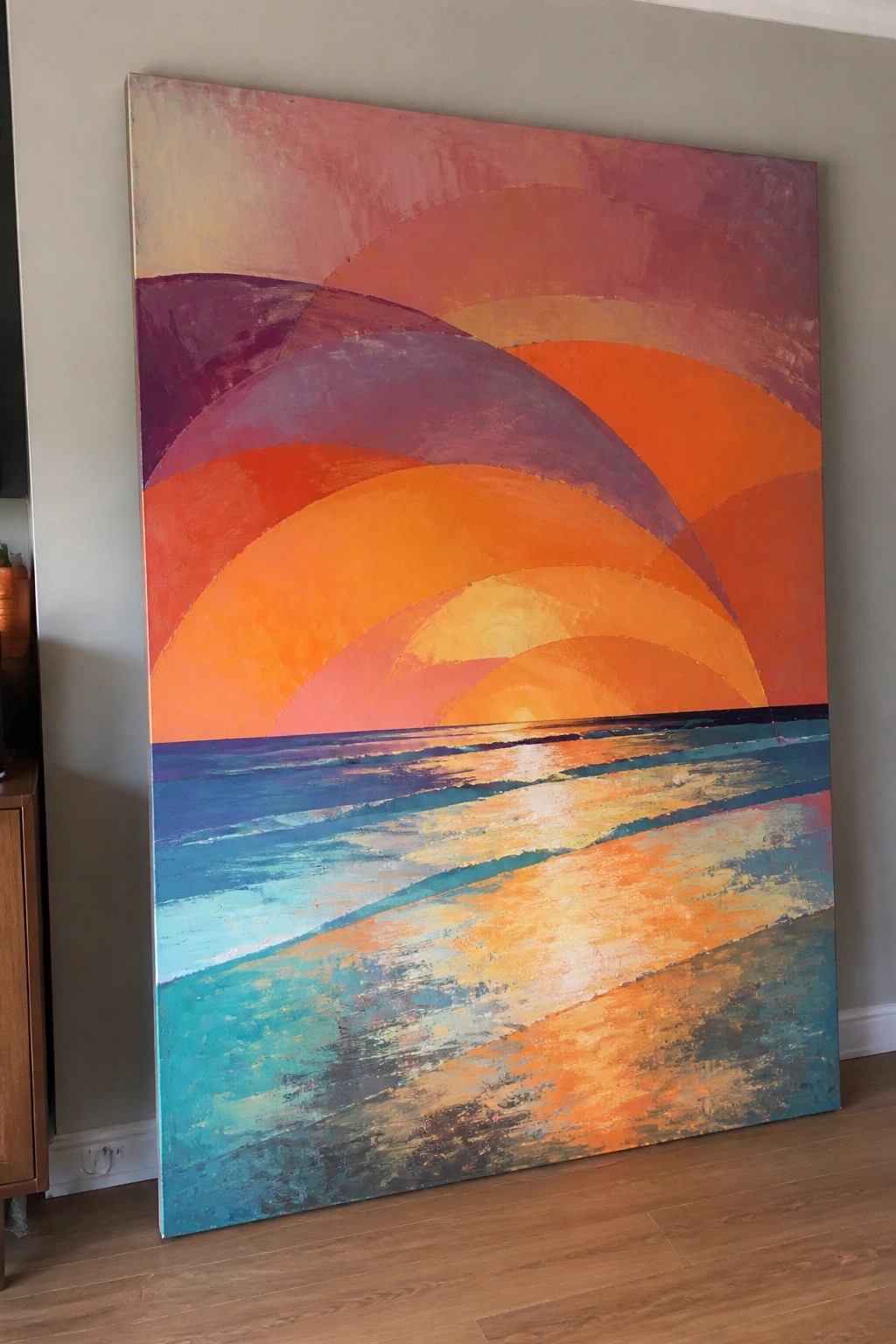 Vibrant abstract painting of sunset arcs over blue and teal ocean waves