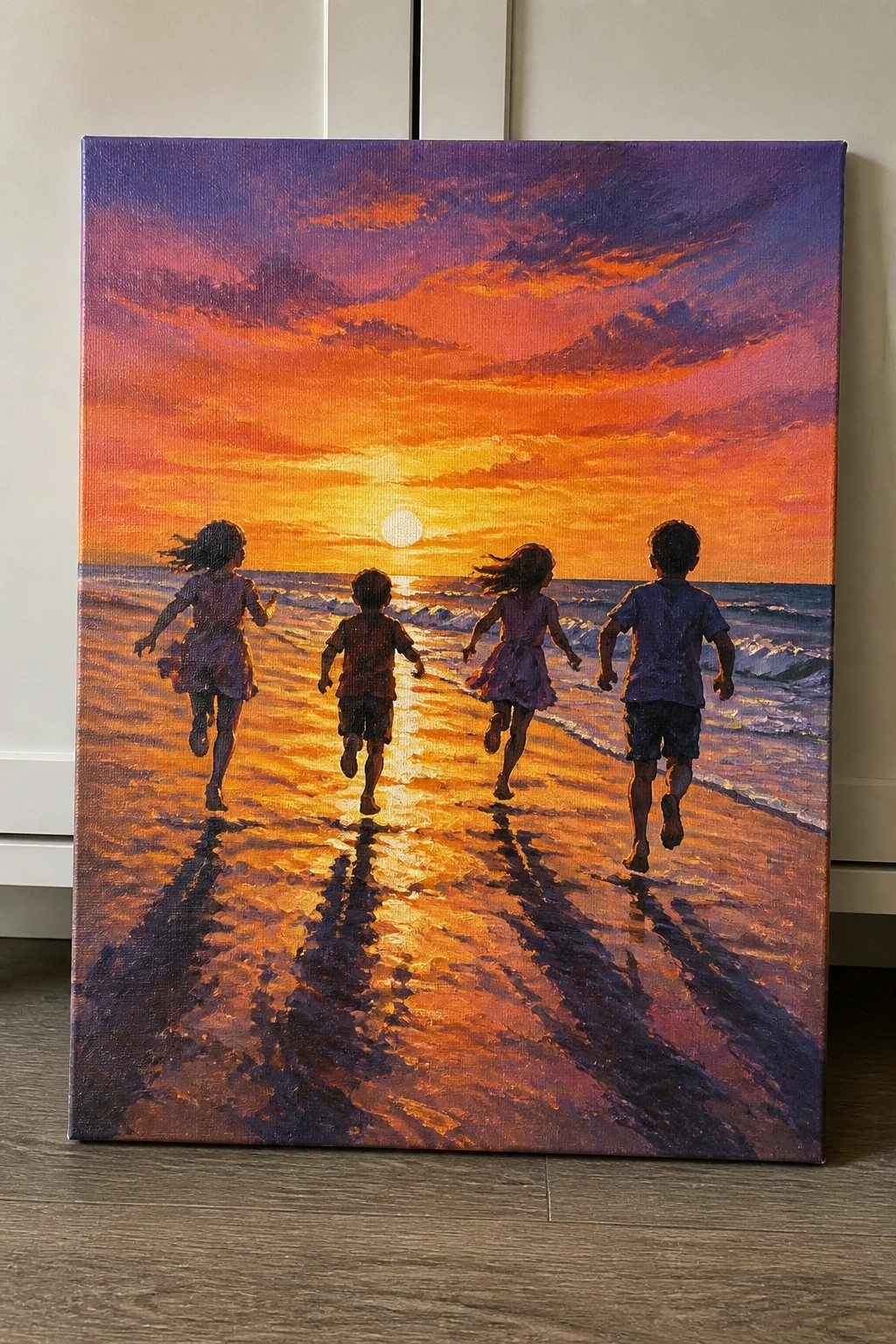 Four children running on beach at sunset with vibrant orange-purple sky and long shadows.
