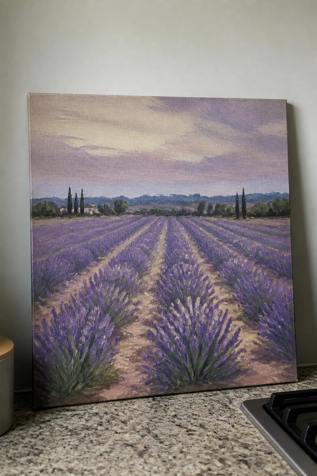 Painting of purple lavender rows, cypress trees, and hills under soft sky.