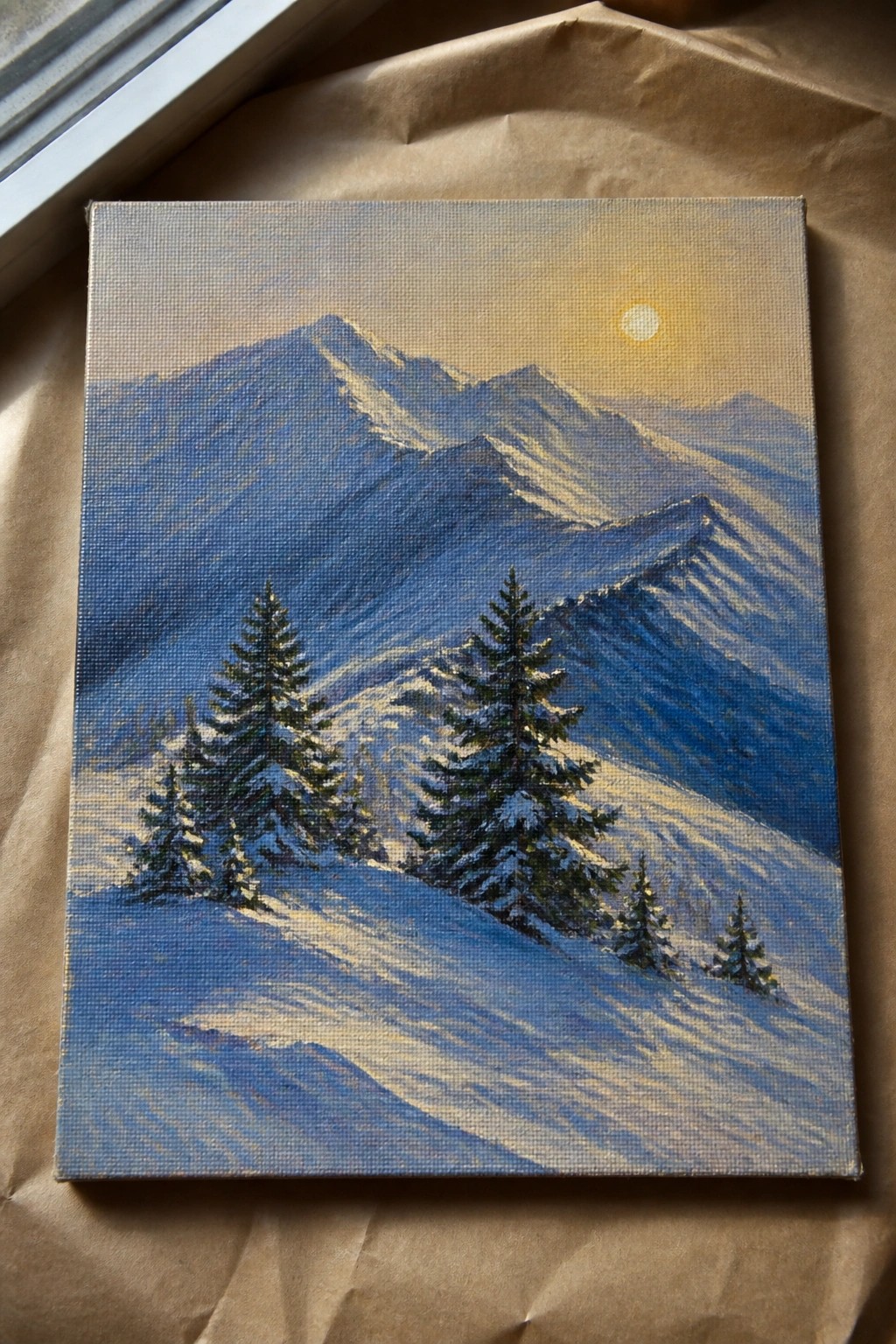Snowy mountain landscape painting with pine trees and yellow sun on canvas