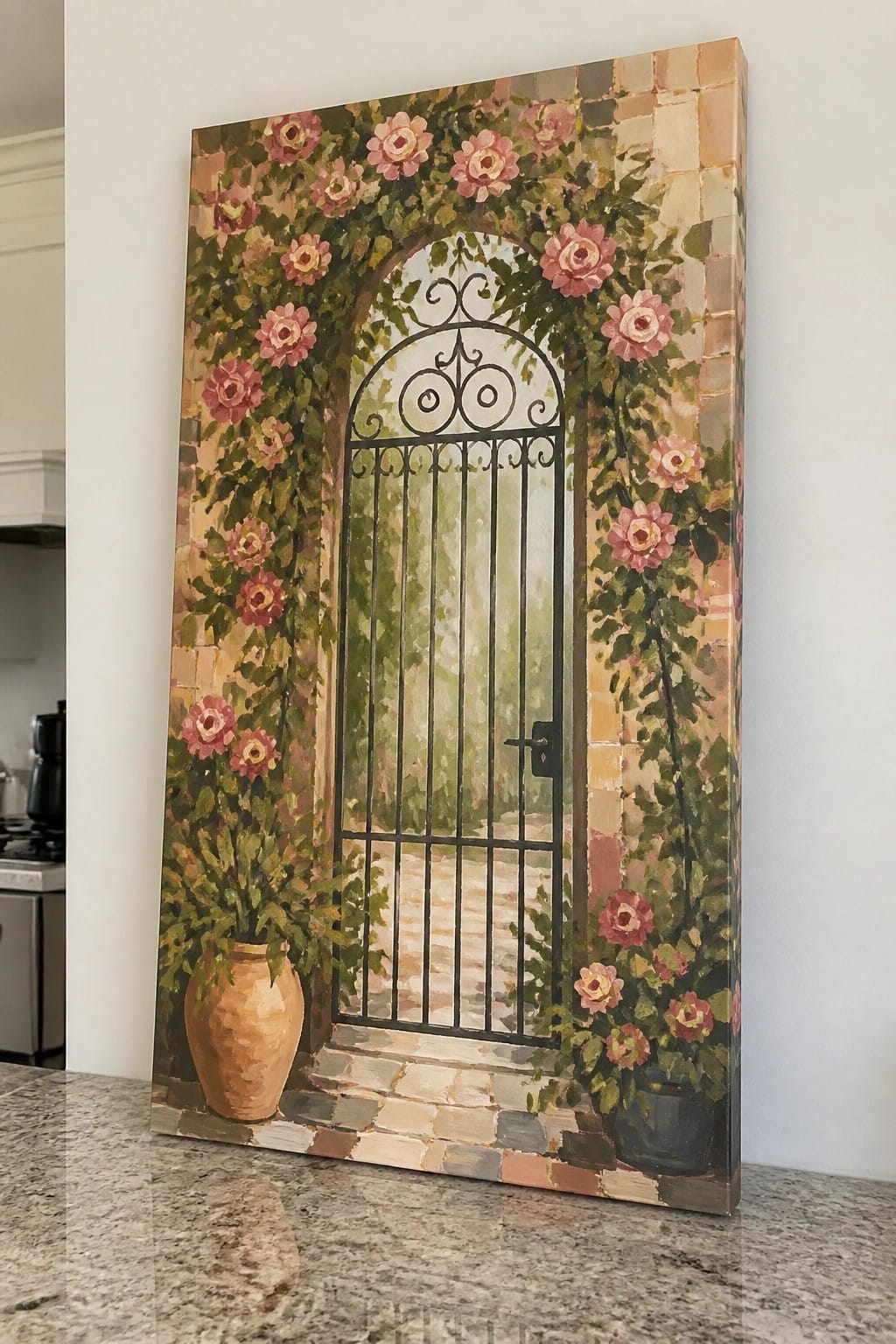 Arched black wrought iron gate amid climbing pink roses on brick wall with potted plants