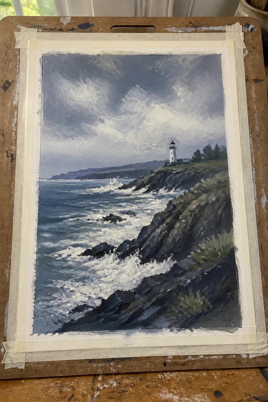 Stormy seascape painting of lighthouse on rocky cliff with crashing waves.