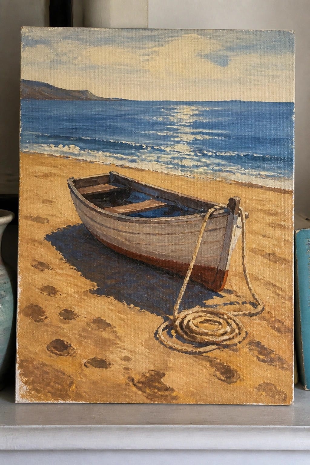 Oil painting of wooden rowboat on sandy beach with blue sea and coiled rope.
