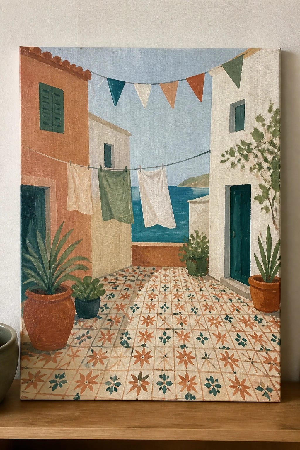Sunlit Mediterranean courtyard painting with patterned tiles, hanging laundry, and potted plants.