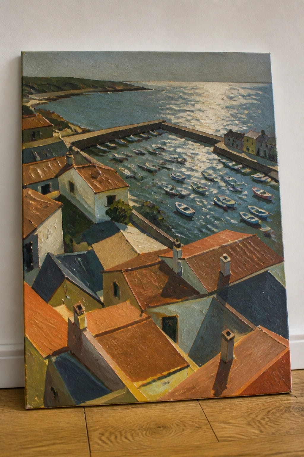Seaside village painting with red rooftops overlooking harbor crowded with small boats